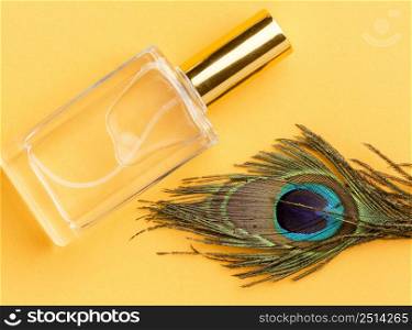 top view organic perfume with peacock feather