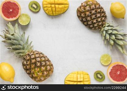 top view organic pineapple with grapefruit kiwi