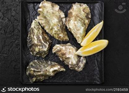 top view oysters with lemon slices
