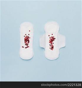 top view pair sanitary towels with red sequins