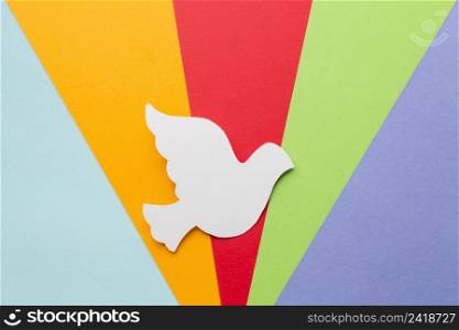 top view paper dove with colors