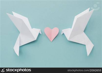 top view paper doves with heart