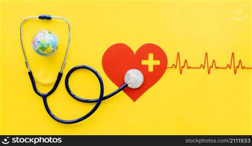 top view paper heart with heartbeat stethoscope