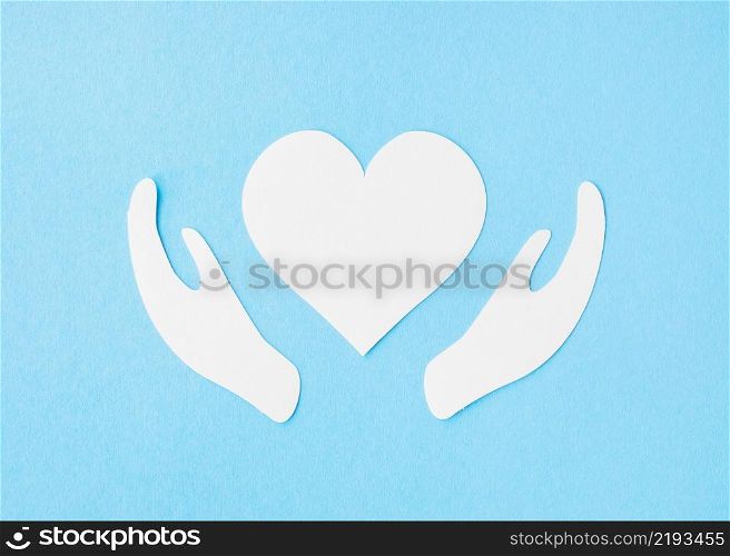 top view paper heart with paper hands