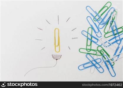 top view paperclip lightbulb. High resolution photo. top view paperclip lightbulb. High quality photo
