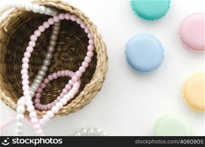 top view pearl necklace with macarons