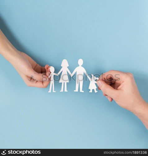 top view people holding hands cute paper family. Resolution and high quality beautiful photo. top view people holding hands cute paper family. High quality and resolution beautiful photo concept