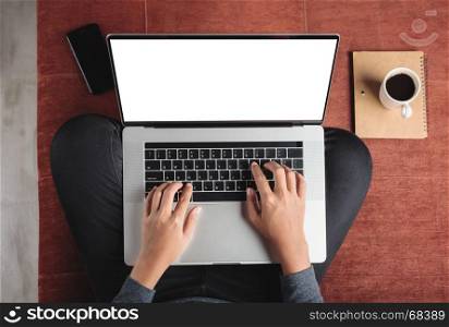top view person using laptop computer on sofa inside home