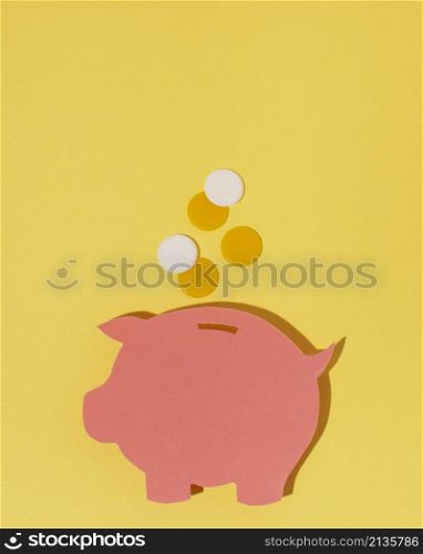 top view piggy bank yellow background