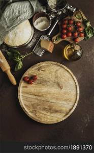 top view pizza dough with wooden board tomatoes. Resolution and high quality beautiful photo. top view pizza dough with wooden board tomatoes. High quality and resolution beautiful photo concept