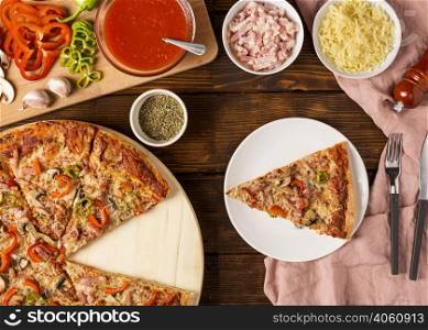 top view pizza with red pepper slice plate
