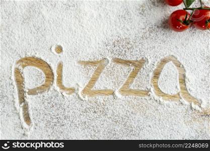 top view pizza word written flour