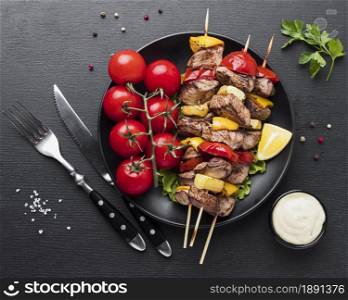top view plate with delicious kebab tomatoes. Resolution and high quality beautiful photo. top view plate with delicious kebab tomatoes. High quality and resolution beautiful photo concept