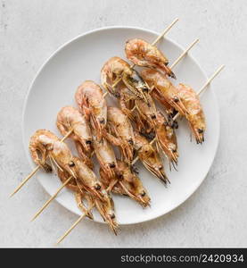 top view plate with shrimp skewers