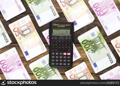 top view pocket calculator euro banknotes