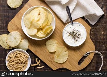 top view potato chips with sauce. High resolution photo. top view potato chips with sauce. High quality photo