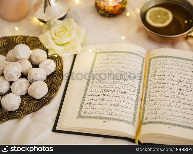 top view quran with tea pastry. Resolution and high quality beautiful photo. top view quran with tea pastry. High quality beautiful photo concept