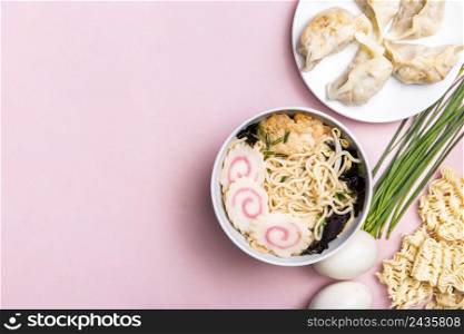 top view ramen soup dumplings ingredients with copy space
