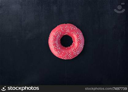 Top view red donut on black wooden table . 3d rendering .