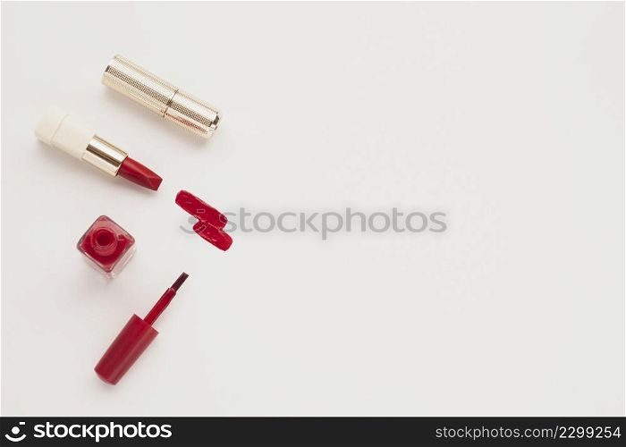 top view red lipstick nail polish with copy space