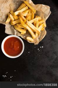 top view salted french fries with ketchup. Resolution and high quality beautiful photo. top view salted french fries with ketchup. High quality beautiful photo concept