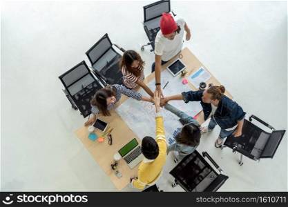 Top view scene of Asian and Multiethnic Business people with casual suit standing and Hand coordination with happy action for teamwork in the modern workplace, people business group concept