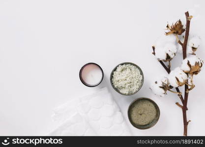 top view scrubs candle napkin cotton twig white surface. Resolution and high quality beautiful photo. top view scrubs candle napkin cotton twig white surface. High quality and resolution beautiful photo concept