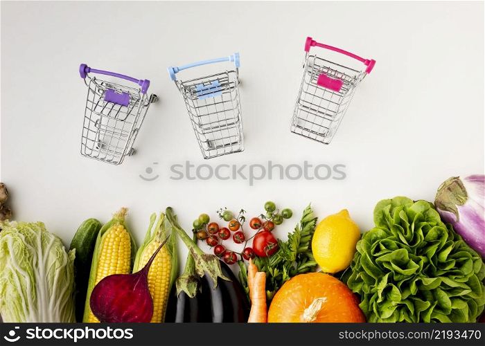 top view shopping carts with delicious veggies