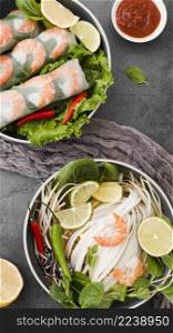 top view shrimp rolls with sauce lemon