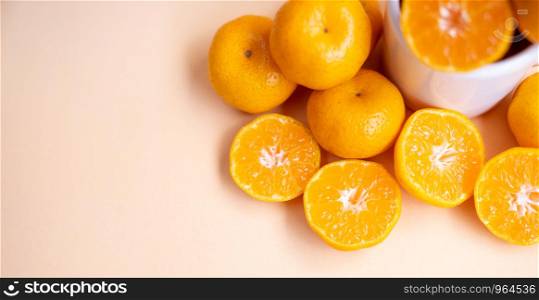 top view sliced fresh orange on cream background