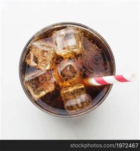 top view soft drink glass with ice cubes straw. High resolution photo. top view soft drink glass with ice cubes straw. High quality photo