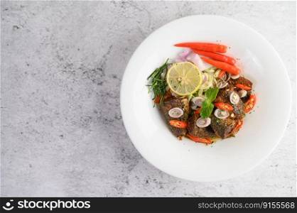 Top view Spicy Canned Sardine Salad with herb ingredient in white dish, copy space