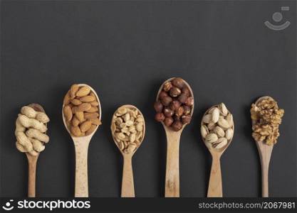 top view spoons with variety nuts