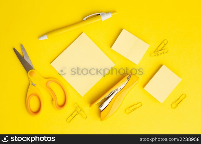 top view stationary arrangement yellow background