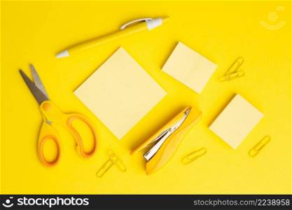 top view stationary arrangement yellow background