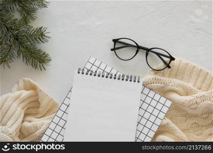 top view stationery empty papers with reading glasses