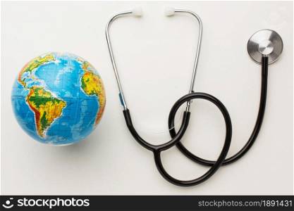 top view stethoscope with earth globe peace day. Resolution and high quality beautiful photo. top view stethoscope with earth globe peace day. High quality and resolution beautiful photo concept