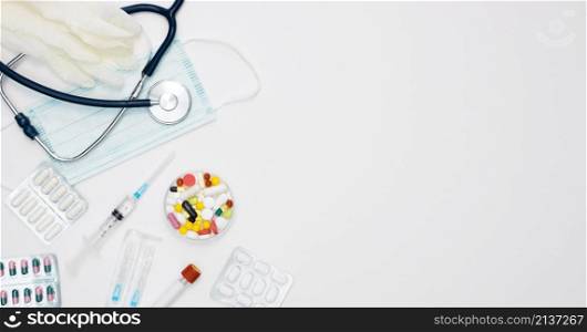 top view stethoscope with syringe pills