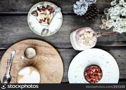 top view sweet and coffee on wood background