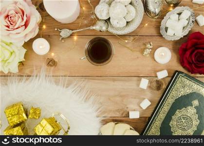 top view table with arabic pastries quran