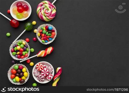 top view tasty candies black table. High resolution photo. top view tasty candies black table. High quality photo