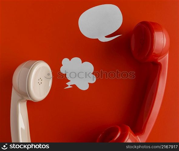 top view telephone receivers with chat bubbles