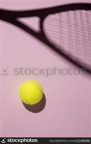top view tennis ball with racket shadow