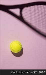 top view tennis ball with racket shadow