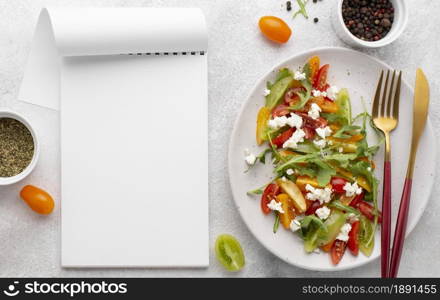 top view tomato mix salad with feta cheese blank notebook. Resolution and high quality beautiful photo. top view tomato mix salad with feta cheese blank notebook. High quality and resolution beautiful photo concept