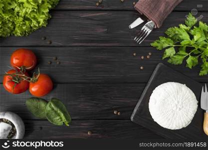 top view tomatoes with spinach cutlery. Resolution and high quality beautiful photo. top view tomatoes with spinach cutlery. High quality and resolution beautiful photo concept