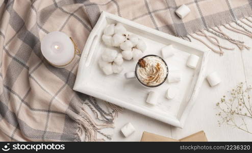 top view tray with coffee with whipped cream candle