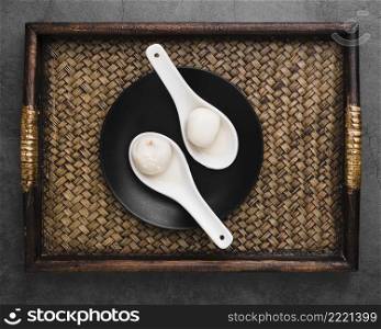 top view tray with dumplings spoons