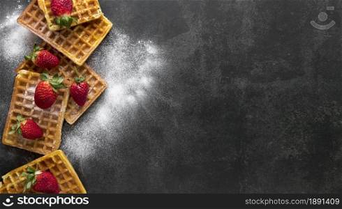 top view waffles with powdered sugar strawberries. Resolution and high quality beautiful photo. top view waffles with powdered sugar strawberries. High quality and resolution beautiful photo concept