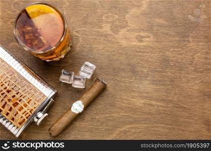 top view whiskey with orange cigar with copy space. Beautiful photo. top view whiskey with orange cigar with copy space